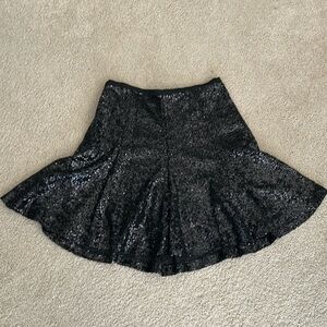 Cece knee length black sequined skirt